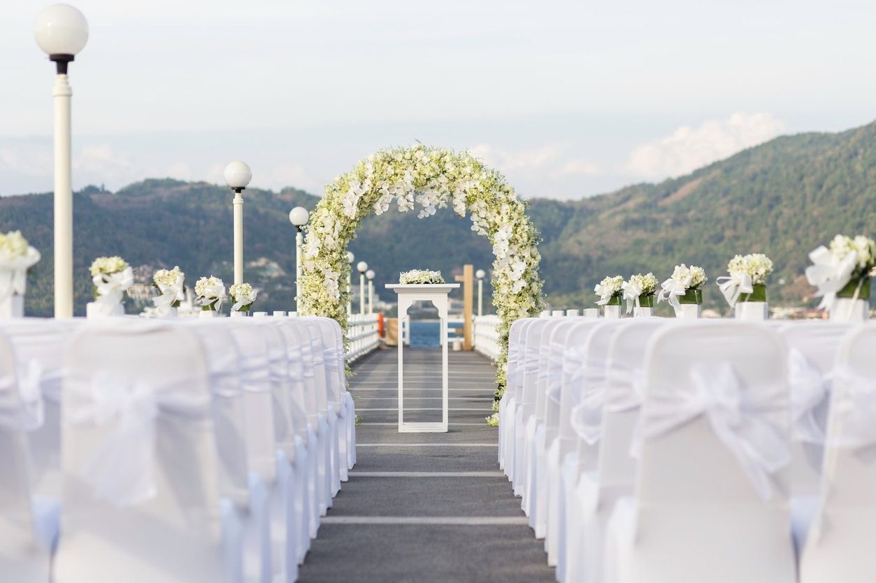Amari Phuket — the timber pier extending over the bay, our most-requested ceremony setting at this resort