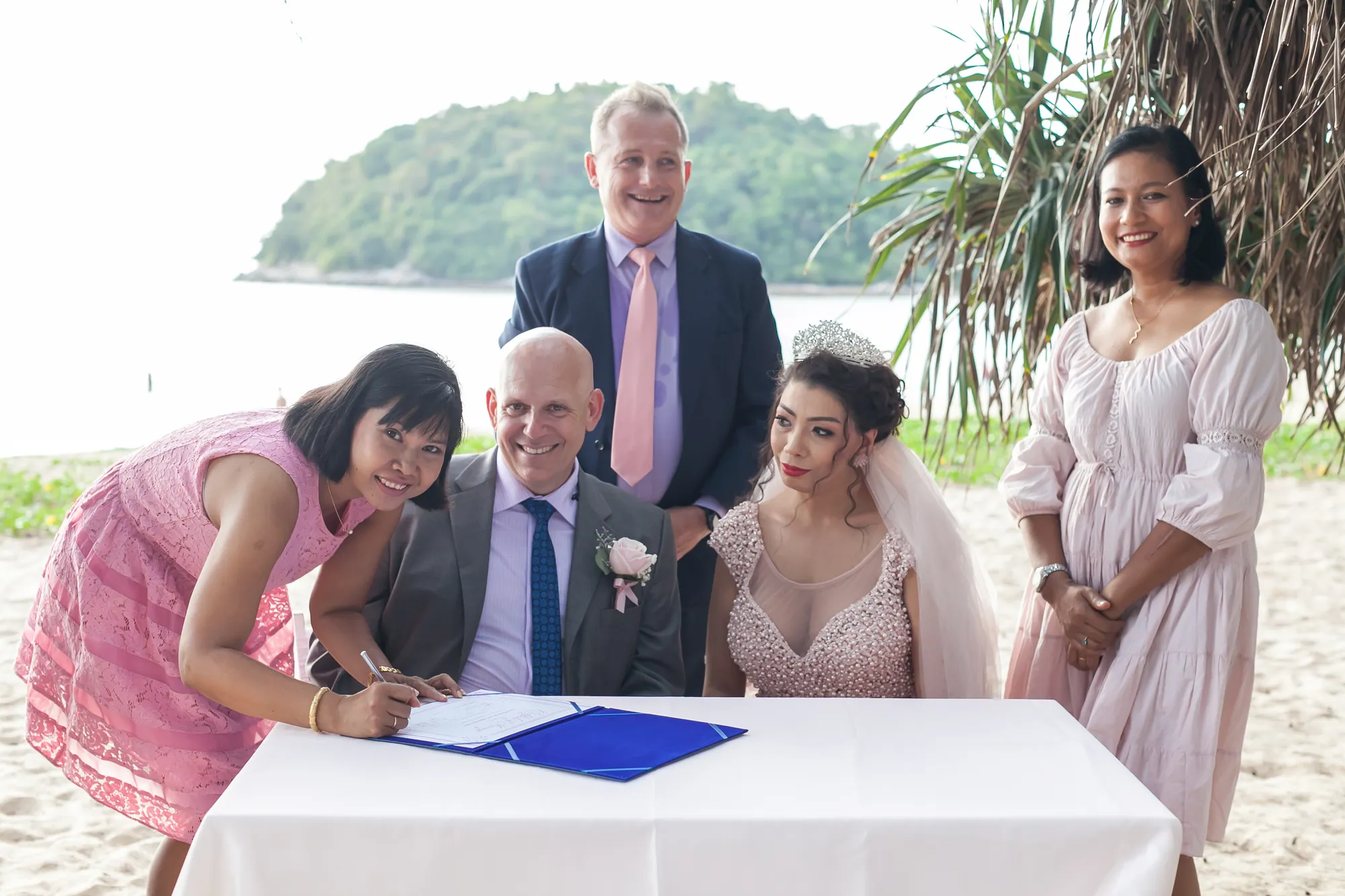 Doug and Parisa signing the marriage register on Layan Beach with Paul and Toom of Unique Phuket, 11 January 2019