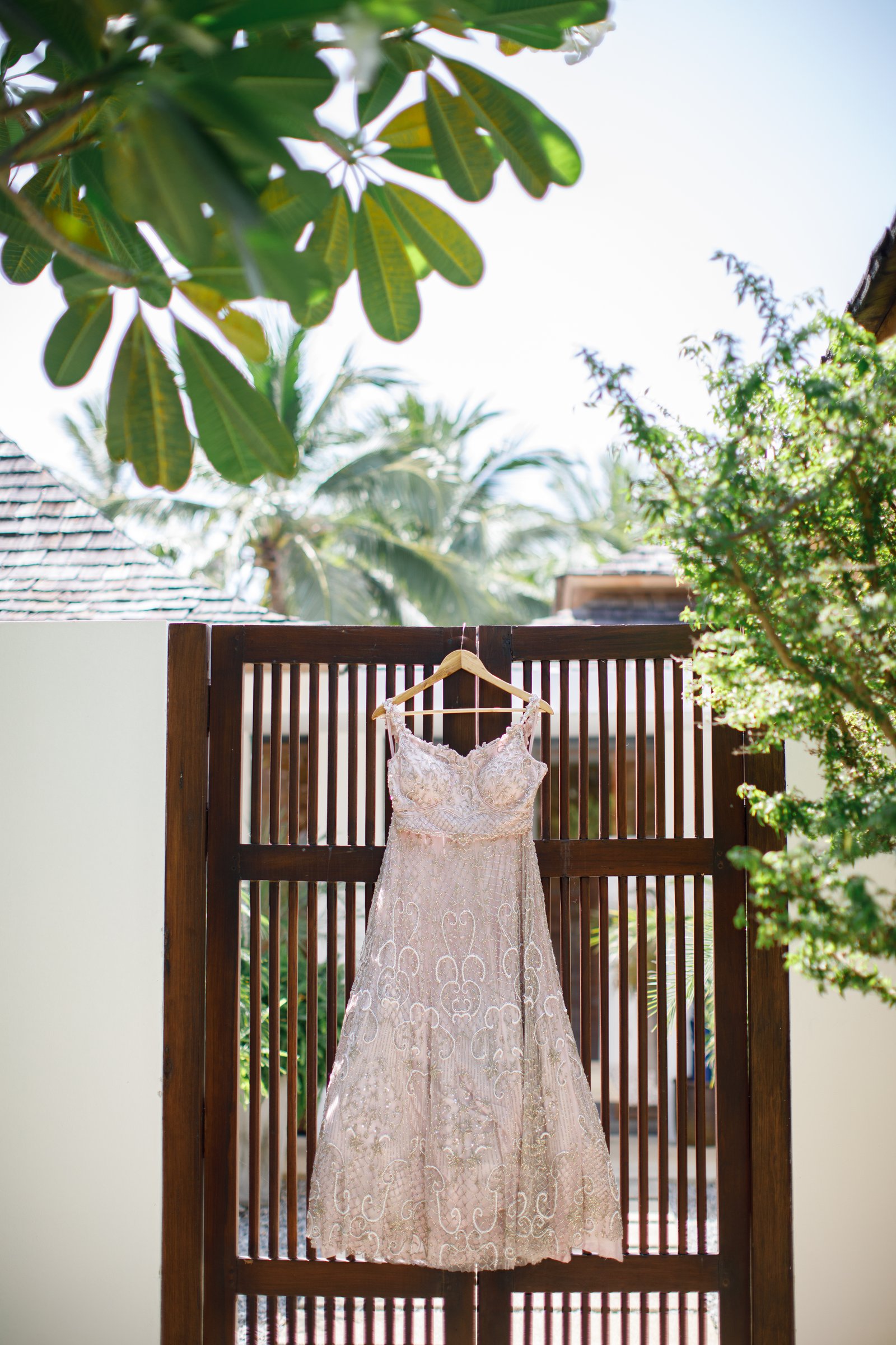Poonam's bridal outfit hanging on a wooden screen at Villa Shanti on the morning of the wedding