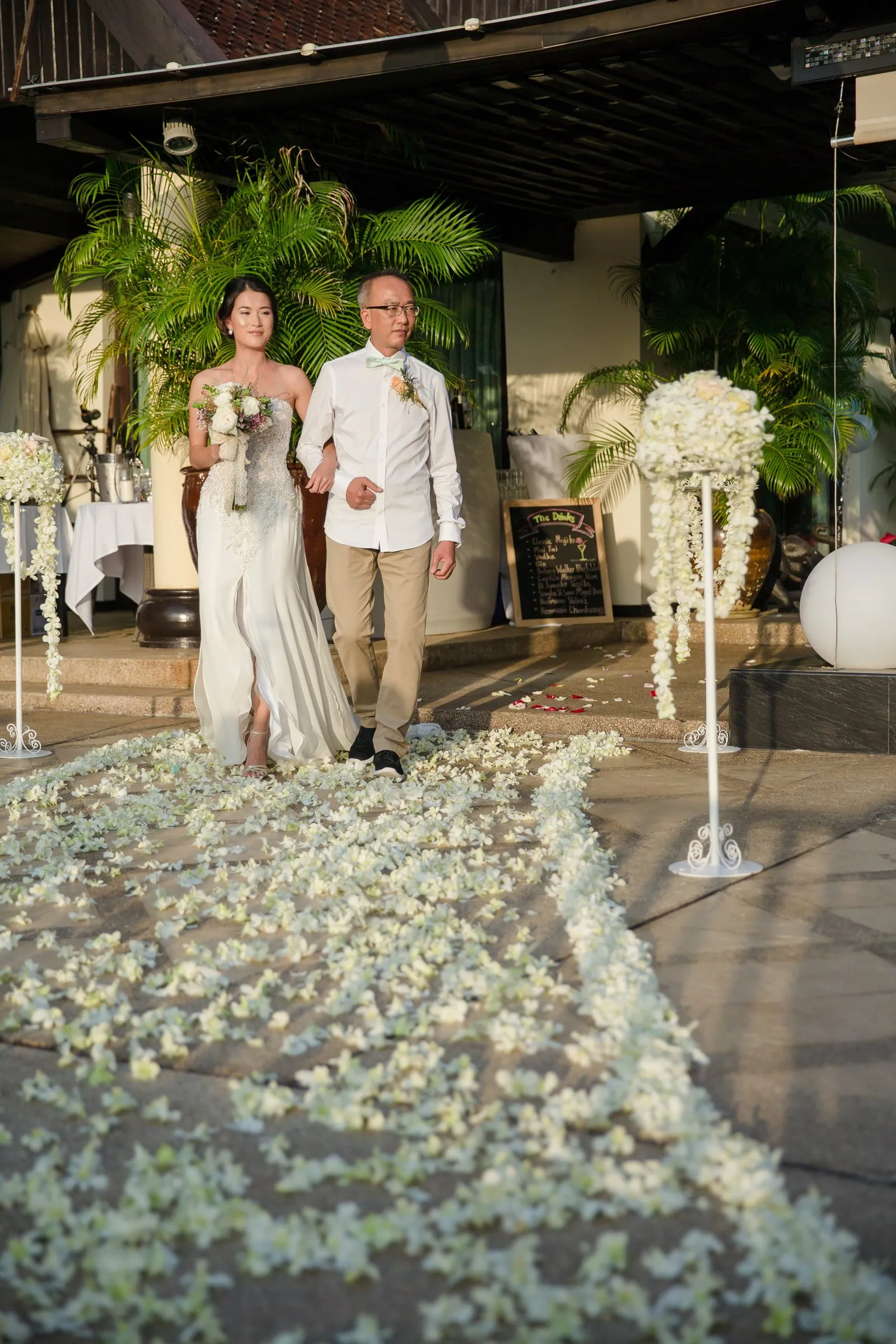 The bride walking down the aisle at Villa Baan Chang Thai