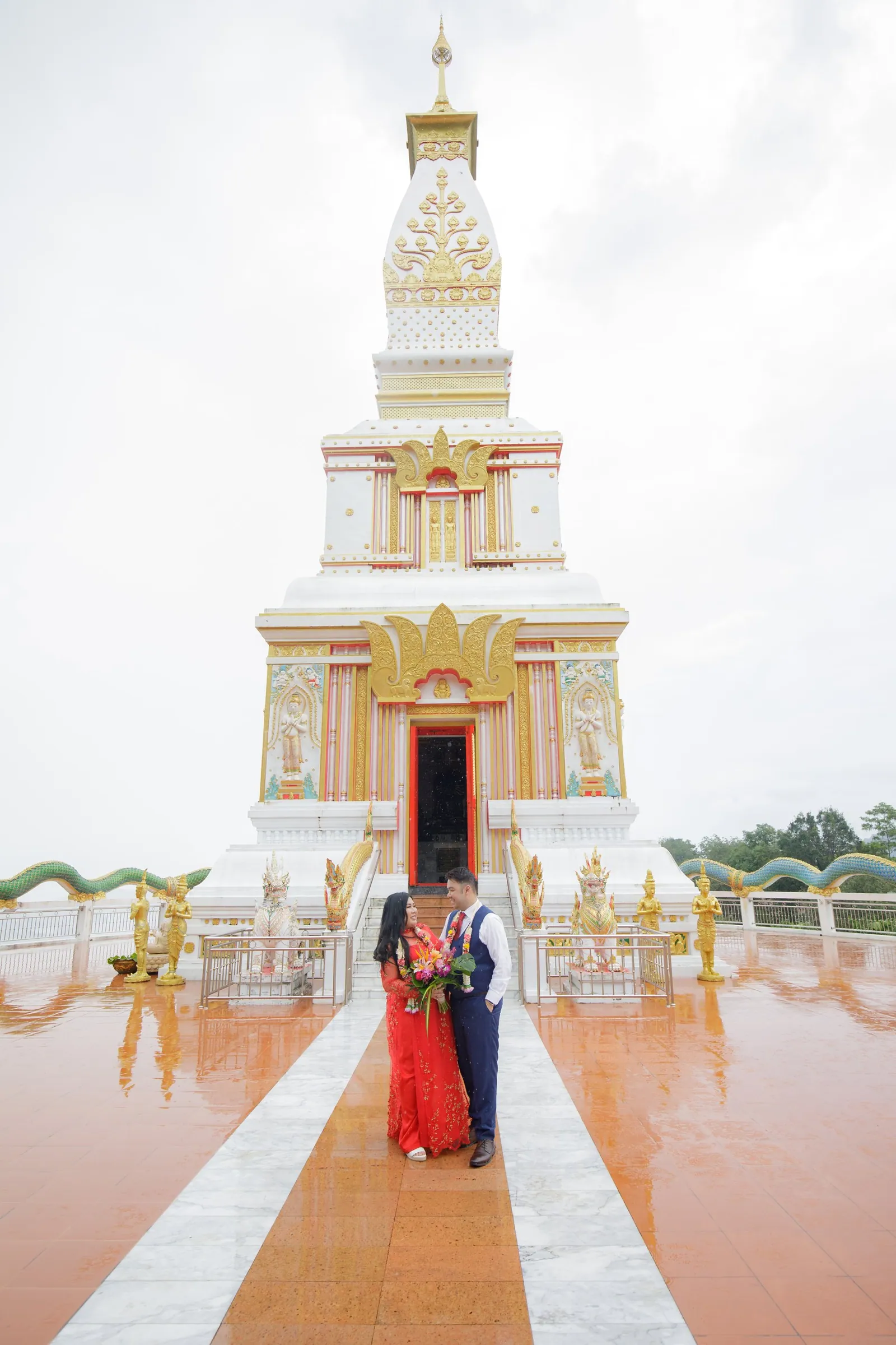 Alan and Thuy walking together at Wat Doi Thep Nimitr on the morning of the blessing