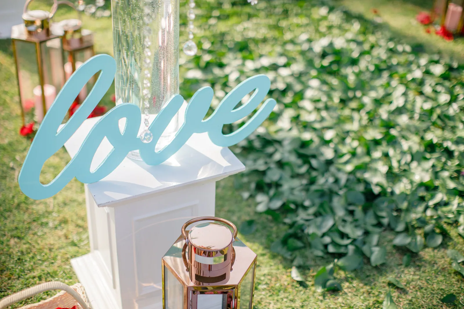 A pale-blue 'love' script sign in the reception styling at Villa Shanti