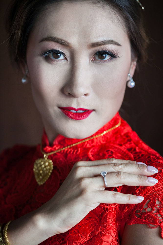 Gerda in a red qipao for the 3:00 PM tea ceremony at Villa Aye
