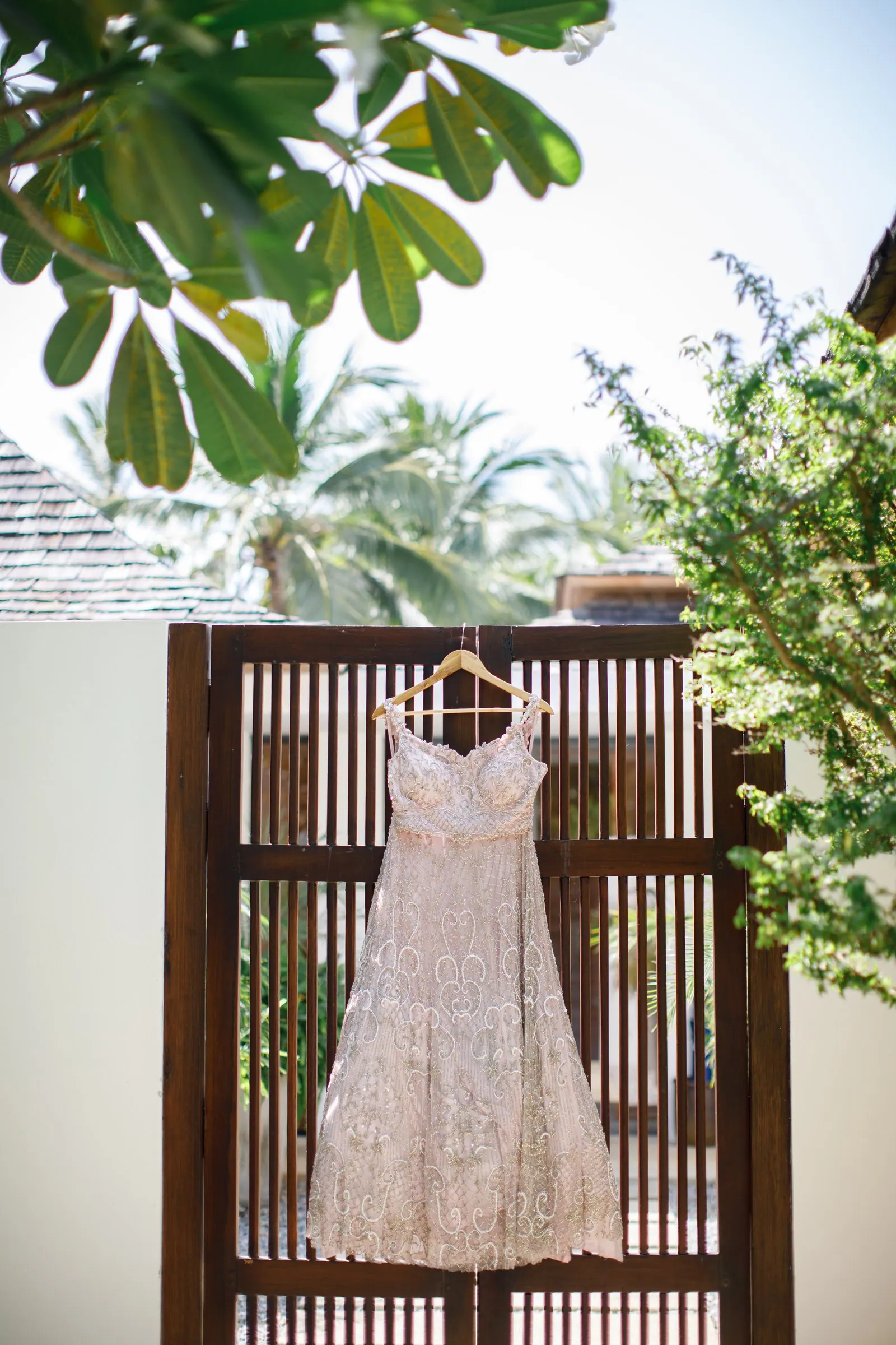 Poonam's bridal outfit hanging on a wooden screen at Villa Shanti on the morning of the wedding