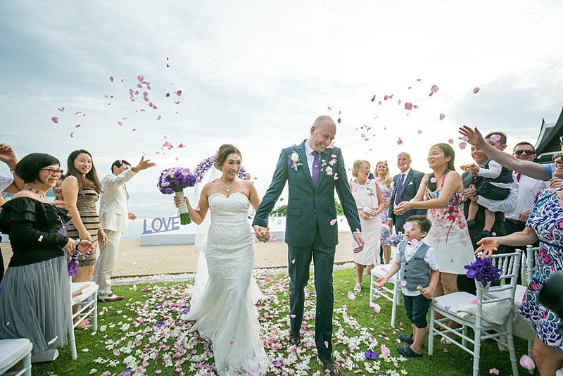 Gerda and Martin walk back down the petal-strewn aisle at Villa Aye, Kamala, after their 11 November 2017 ceremony