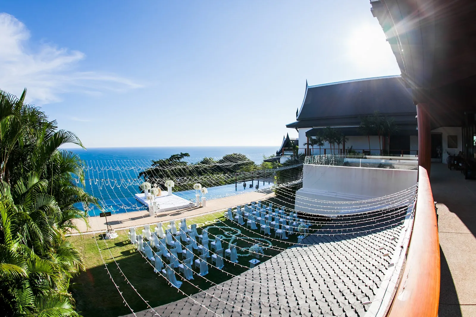 Villa Aye set for Kailey and Daniel's ceremony — fairy lights strung above the ocean-view lawn on 4 May 2018