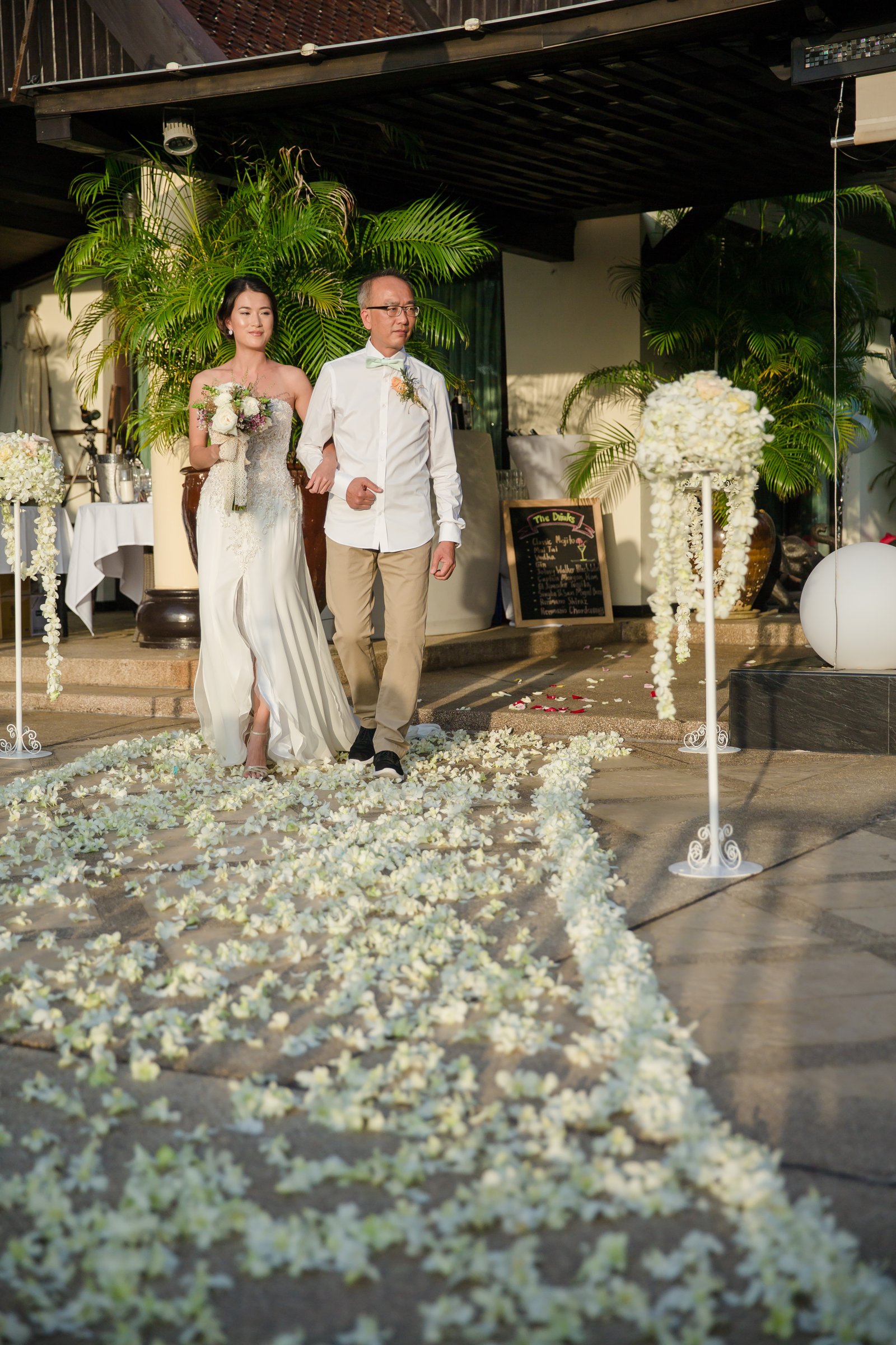 The bride walking down the aisle at Villa Baan Chang Thai