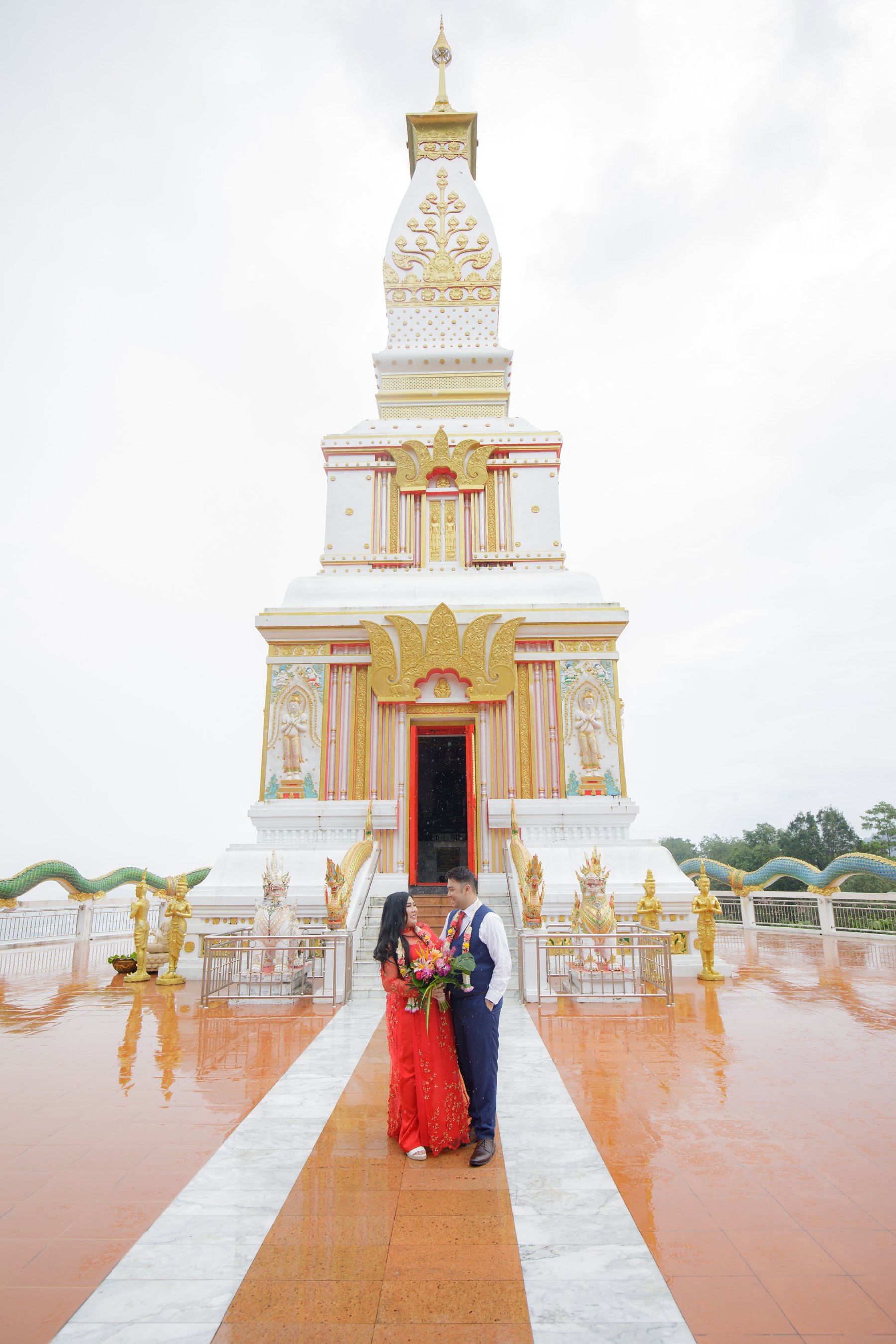 Alan and Thuy walking together at Wat Doi Thep Nimitr on the morning of the blessing