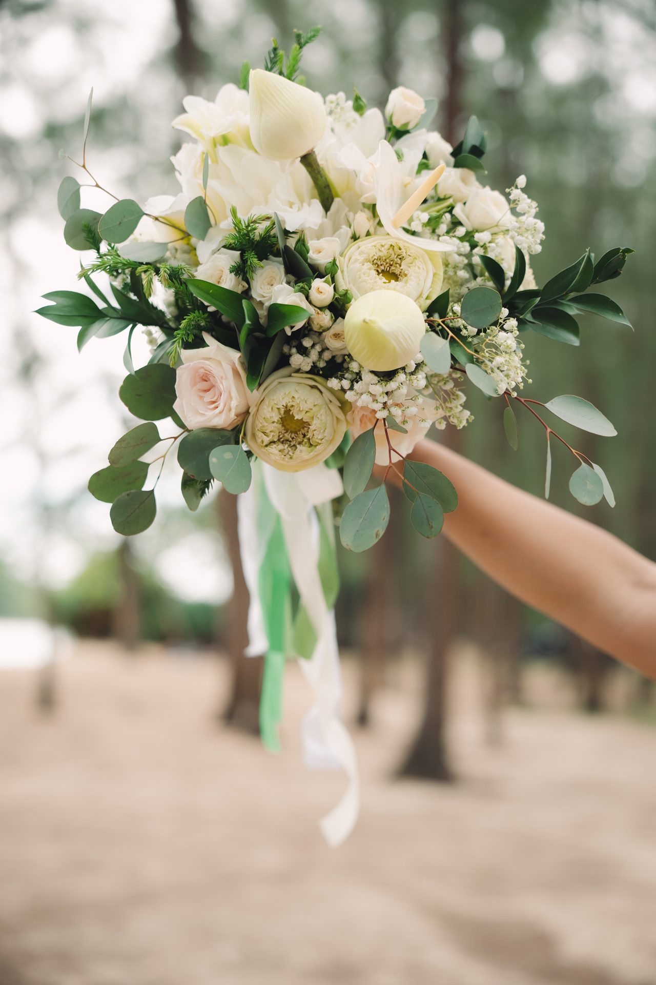 The small Buddhist altar and offerings set out on Layan Beach beneath the trees before Joanne and Richard's ceremony