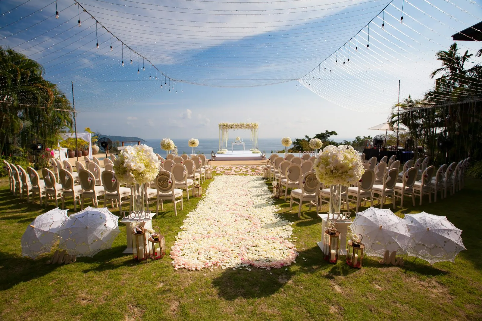 Villa Aye — pool terrace laid for a wedding ceremony