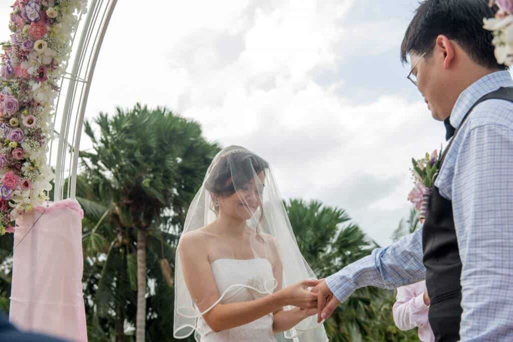 George and Gan Wan Wei exchanging rings during the ceremony