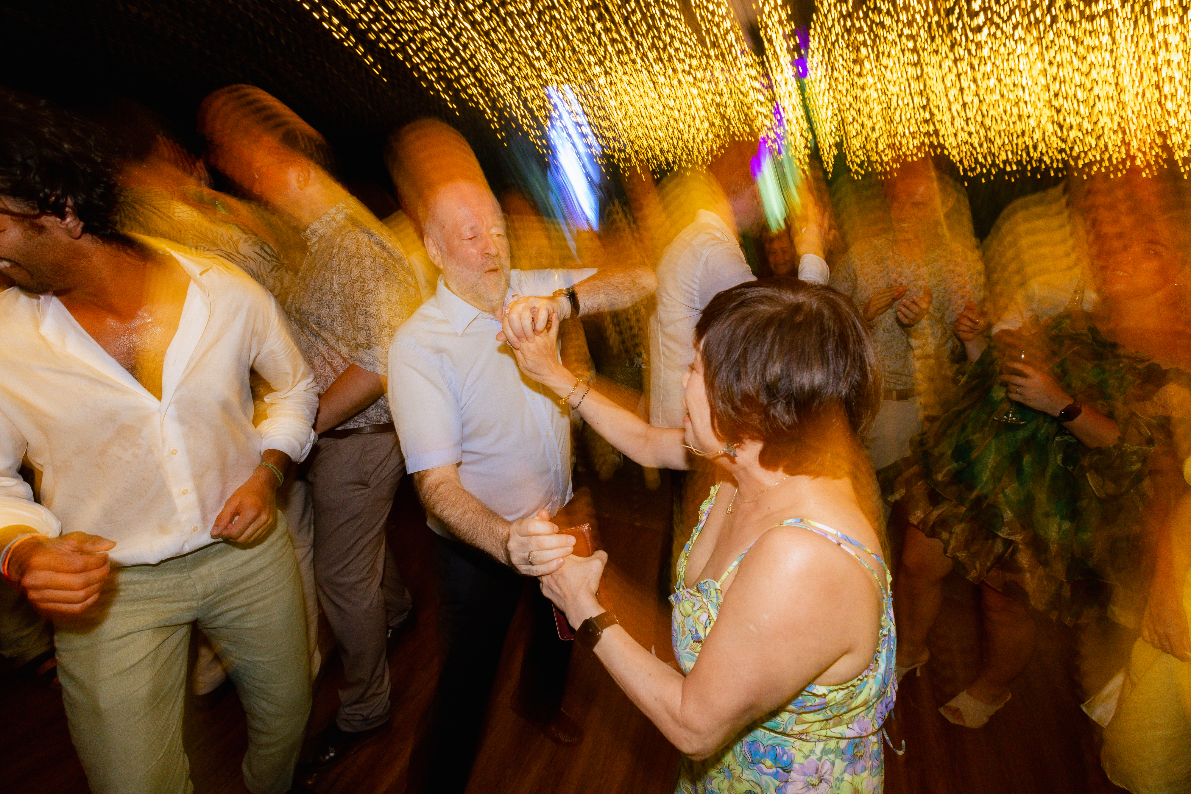Guests dancing at Sarah and Simon's post-wedding party at Villa Aye