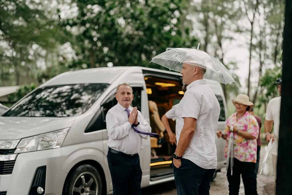 Wedding planner meeting couple before Phuket vow renewal transport to beach